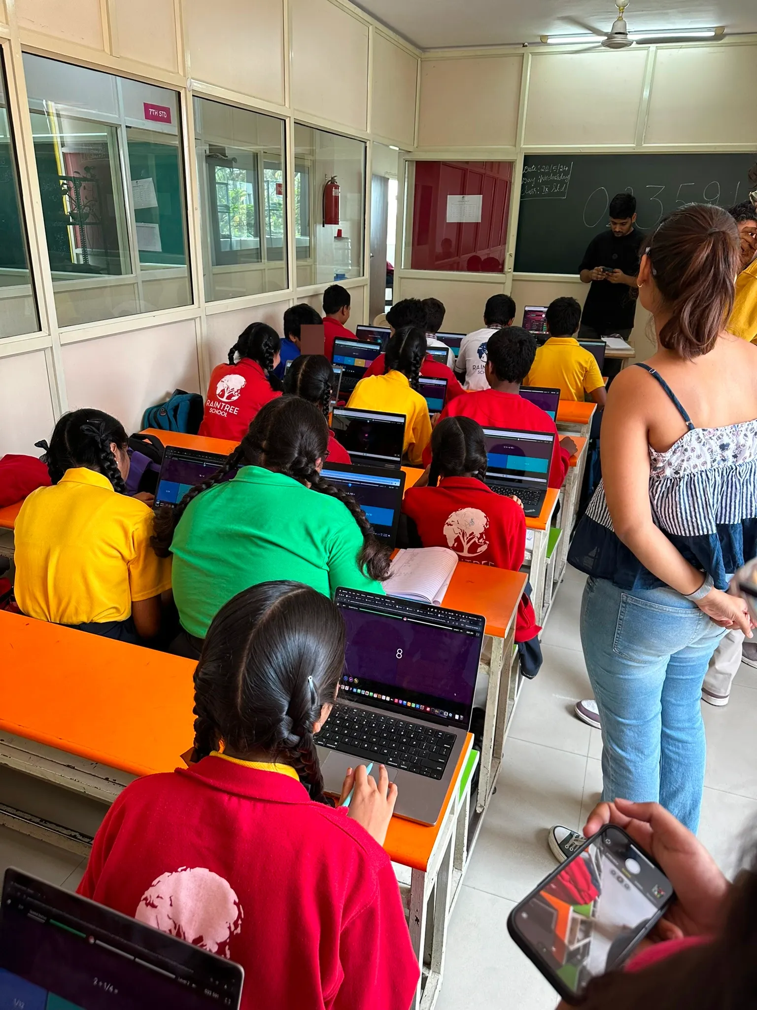 Fieldwork session with students using laptops in a classroom
