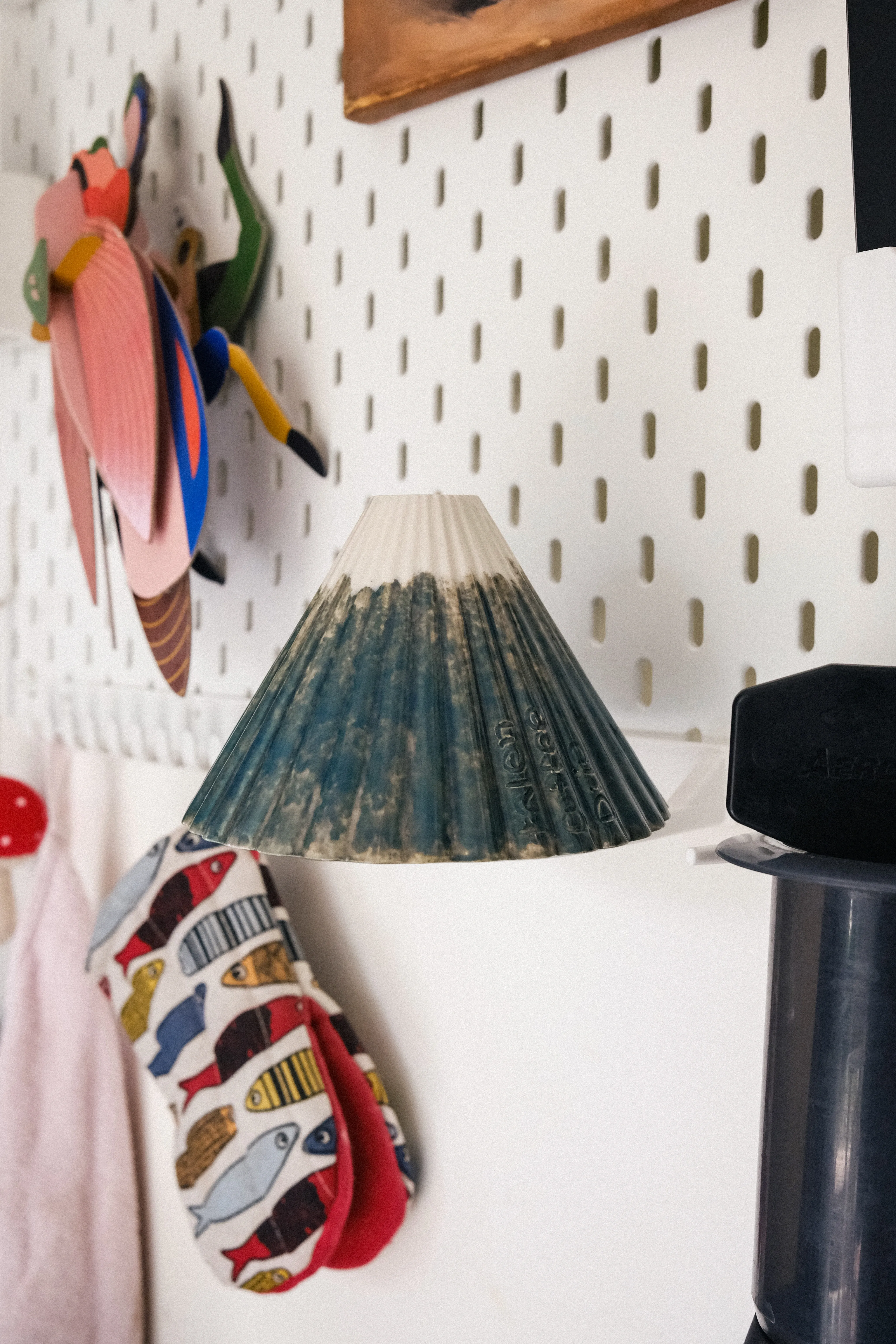 Ceramic V60 held upright on a white IKEA SKADIS pegboard